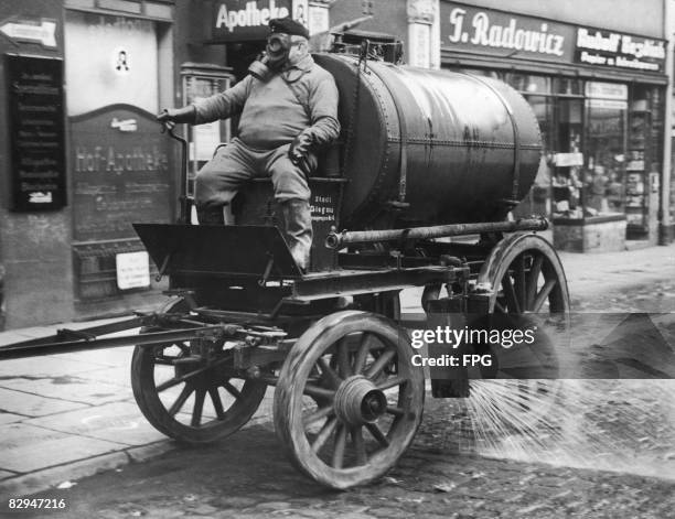 Gas decontamination wagon cleans the streets during an air raid exercise in Glogau, Germany , circa 1938.