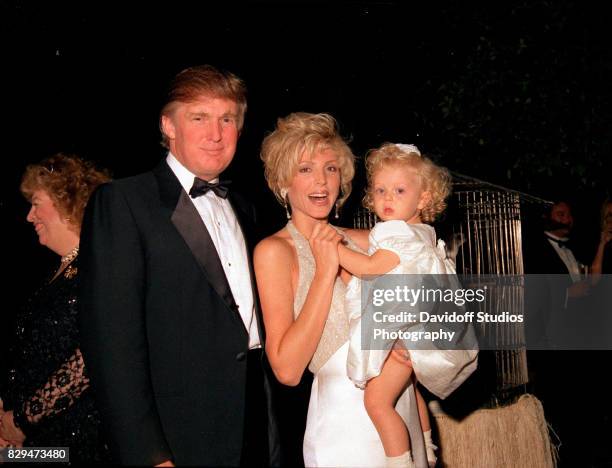 Portrait of married American couple, real estate developer Donald Trump and actress Marla Maples, and their daughter, Tiffany, as they pose together...