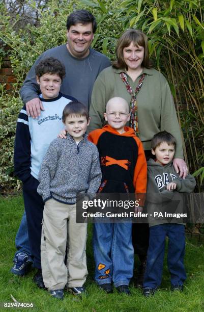 Daniel Hartley, 8 is re-united with his parents David and Allison and brothers Joshua Nathan, 11 and Luke, 4 at home after arriving home from...