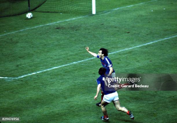 Michel Platini and Bruno Bellone of France celebrates his goal during the European Championship match between France and Denmark at Parc des Princes,...