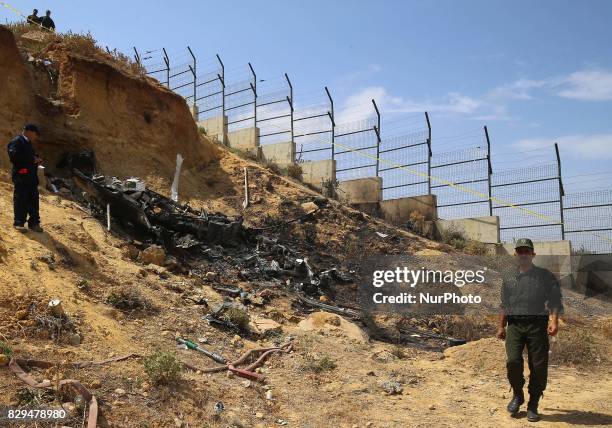 Algerian rescue workers inspect the site of a helicopter crash, Bel 206, belonging to Tassili Airlines, which killed four people, on August 10 in...