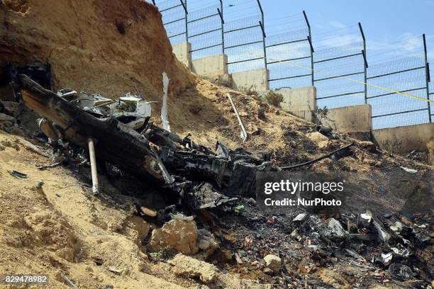 Algerian rescue workers inspect the site of a helicopter crash, Bel 206, belonging to Tassili Airlines, which killed four people, on August 10 in...