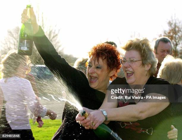 Jenny Jackman and Paula Hattersley, two of the 25 syndicate members, celebrate winning 14 469.