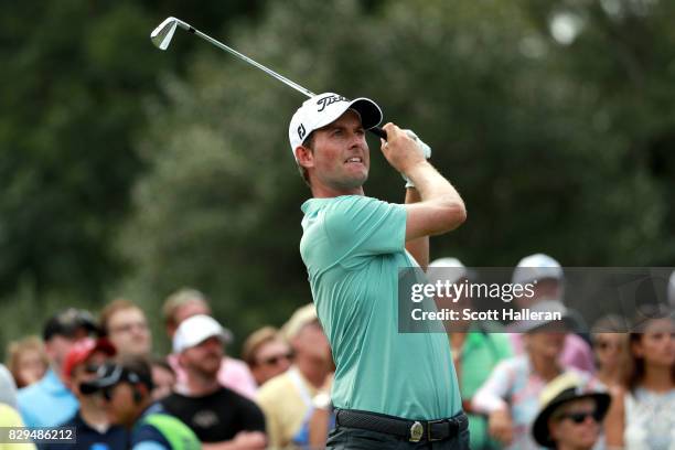 Webb Simpson of the United States plays his shot from the 13th tee during the first round of the 2017 PGA Championship at Quail Hollow Club on August...