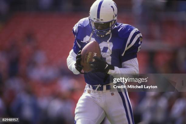 Marshall Faulk of the Indianapolis Colts catches a pass during a NFL football game against the Washington Redskins on October 27, 1996 at RFK Stadium...