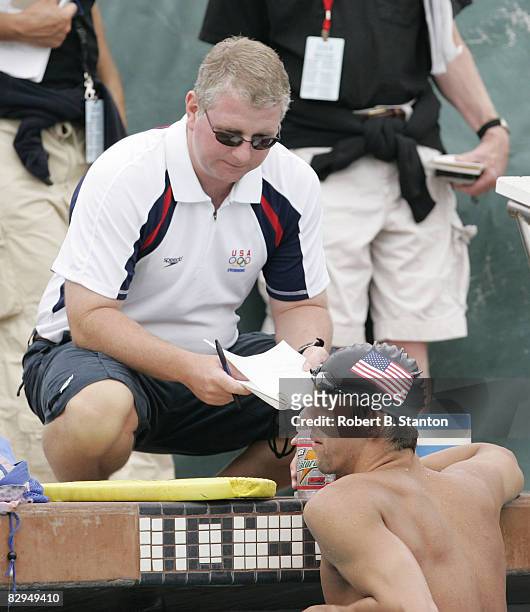 Michael Phelps talks with coach Bob Bowman at Media Opportunity Day for the U.S. Olympic Swimming Team at Stanford University, July 24, 2004.
