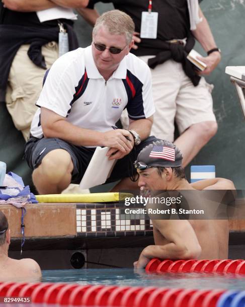 Michael Phelps talks with coach Bob Bowman at Media Opportunity Day for the U.S. Olympic Swimming Team at Stanford University, July 24, 2004.