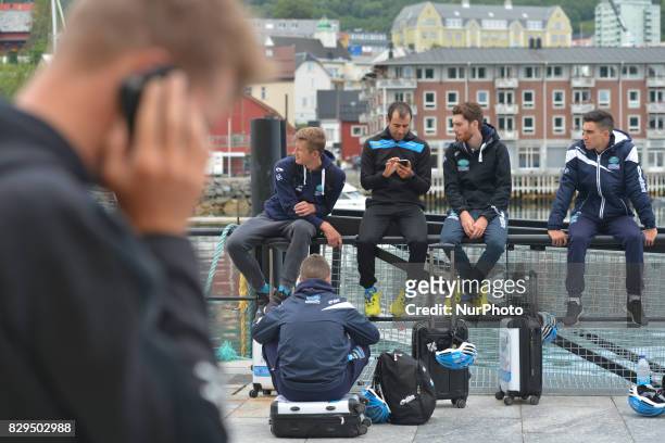 Members of Delko Marseille Provence KTM team awaiting for a boat in Harstad Harbour to be transported to the start at Andorja Island, ahead of the...