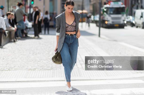 Irina Lakicevic wearing croped flared denim jeans, blazer outside Baum Und Pferdgarten on August 10, 2017 in Copenhagen, Denmark.