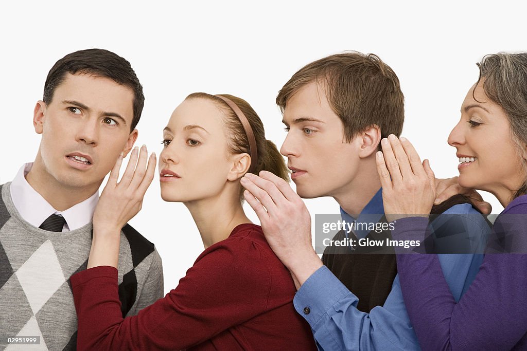 Business executives whispering to each other