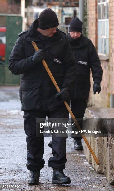 Police search team examine the area surrounding a house in Hockliffe. The Police are investigating a double murder after the bodies of two people...