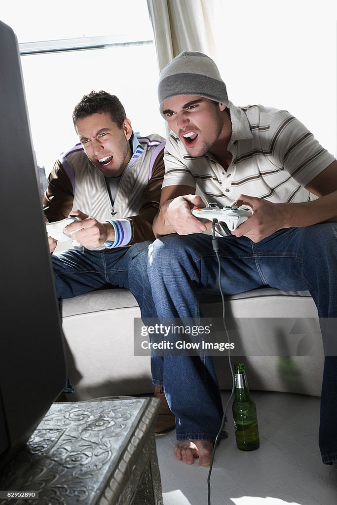 Young men playing a video game