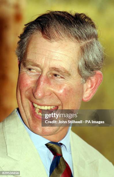 The Prince of Wales laughs as he refuses to eat a Witchety bug during his visit to the Desert Park on the outskirts of Alice Springs.