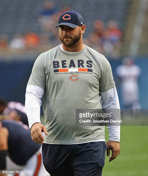 Kyle Long of the Chicago Bears encourages teammates during warm-ups before a preseason game against the Denver Broncos at Soldier Field on August 10,...