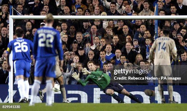 Barcelona's Ronaldinho scores from the penalty spot past Chelsea goalkeeper Petr Cech .