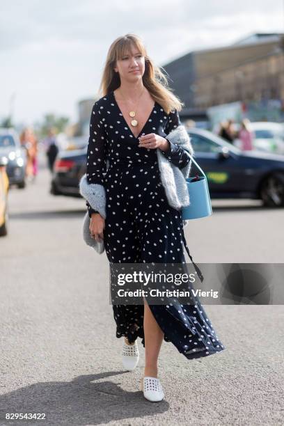 Lisa Aiken wearing a dress with dot print outside Ganni on August 10, 2017 in Copenhagen, Denmark.