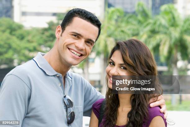 portrait of a couple smiling - long straight black hair stock pictures, royalty-free photos & images