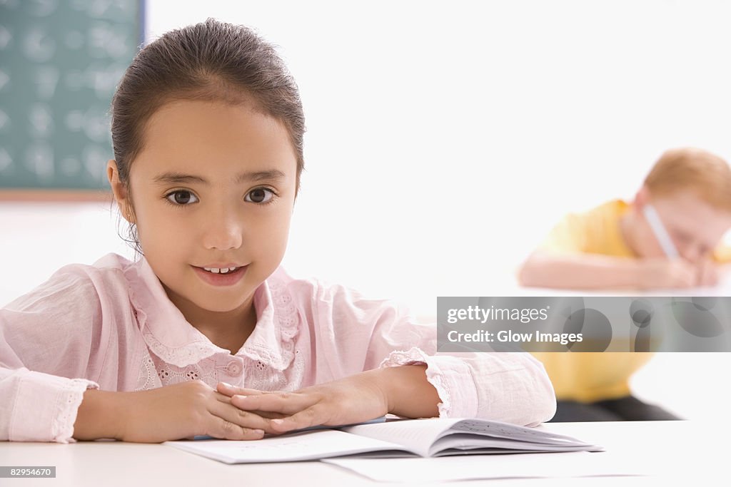 Portrait of a girl sitting in a classroom