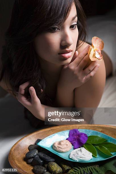 close-up of a young woman lying on a massage table - fat massage bildbanksfoton och bilder