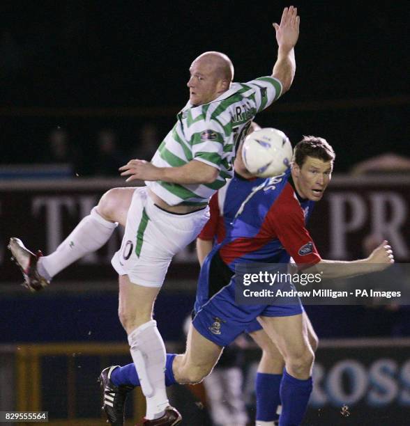 Celtic's John Hartson challenges Inverness Caledonian Thistles' Darren Dods .