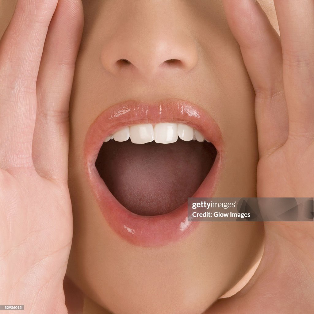 Close-up of a young woman shouting