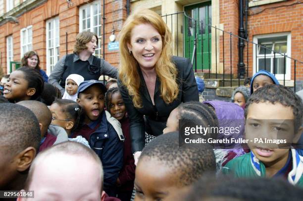 The Duchess of York is surrounded by pupils as she leaves.