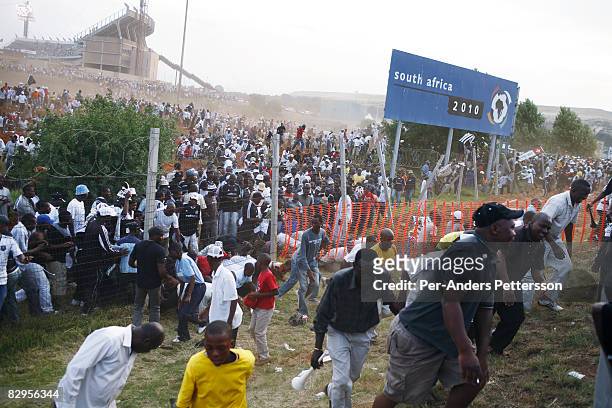 Thousands of soccer fans leave FNB stadium after a derby between local teams Kaizer Chiefs and Orlando Pirates on December 9, 2006 in Johannesburg,...