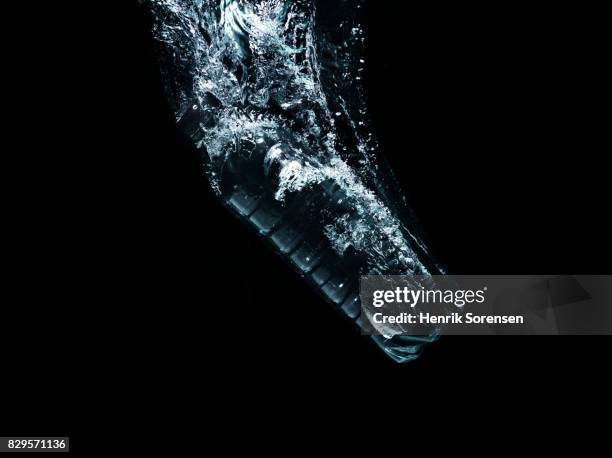 water bottle in water - water bottle splash stock pictures, royalty-free photos & images