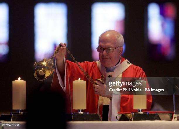 Archbishop Patrick Kelly, wearing the vestments worn by the late Pontiff during his visit to the city in 1982, celebrates mass.