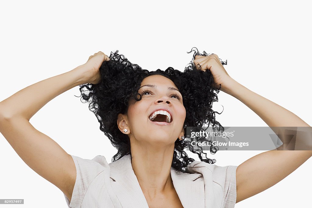 Close-up of a young woman holding her hair