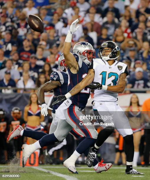 Rashad Greene of the Jacksonville Jaguars is unable to catch the football as Jason Thompson of the New England Patriots draws an interference call in...