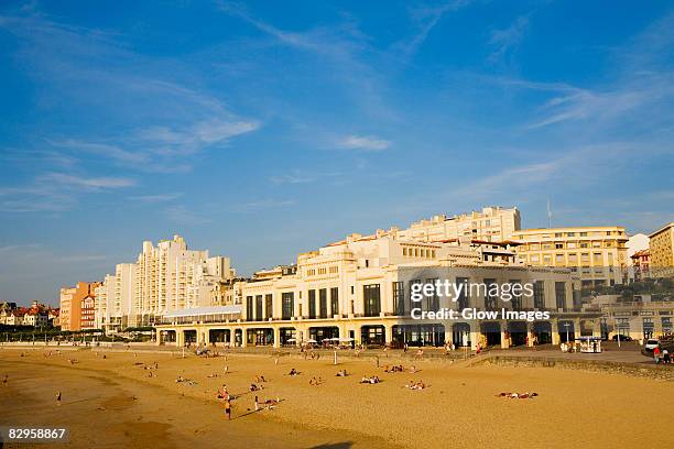 tourists on the beach, casino municipal, grande plage, biarritz, france - biarritz stockfoto's en -beelden