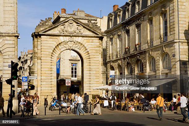 tourists in a street, porte dijeaux, vieux bordeaux, bordeaux, france - bordeaux square stock pictures, royalty-free photos & images