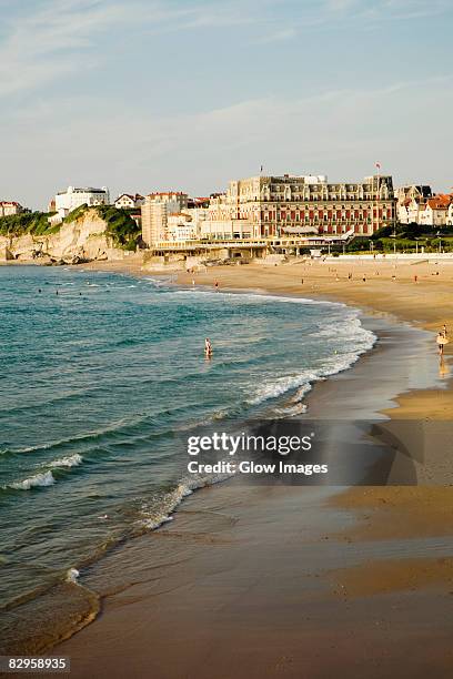 high angle view of waves on the beach, grande plage, hotel du palais, biarritz, france - biarritz fotografías e imágenes de stock