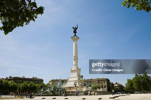 low angle view of a monument, fontaine des quinconces, monument aux girondins, bordeaux, aquitaine, france - monument stockfoto's en -beelden