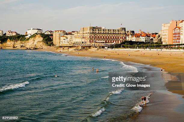waves on the beach, grande plage, hotel du palais, biarritz, france - biarritz stock-fotos und bilder