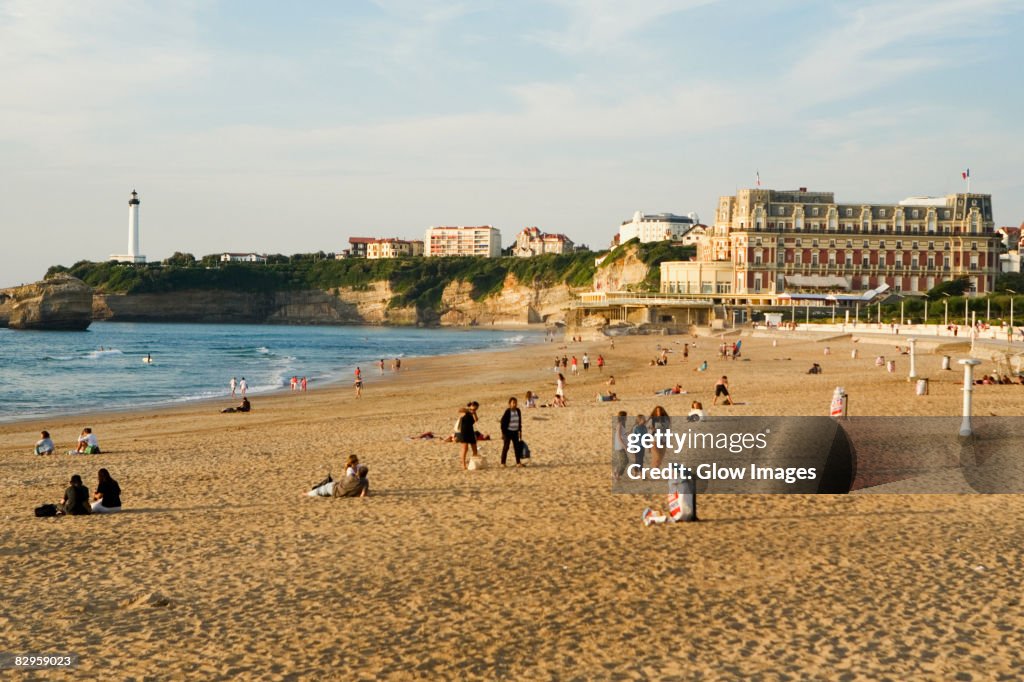 Tourists on the beach, Phare de Biarritz, Hotel du Palais, Grande Plage, Biarritz, France