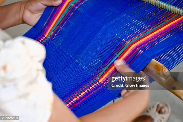 close-up of a woman weaving textile, santo tomas jalieza, oaxaca state, mexico - mexican textile stock pictures, royalty-free photos & images