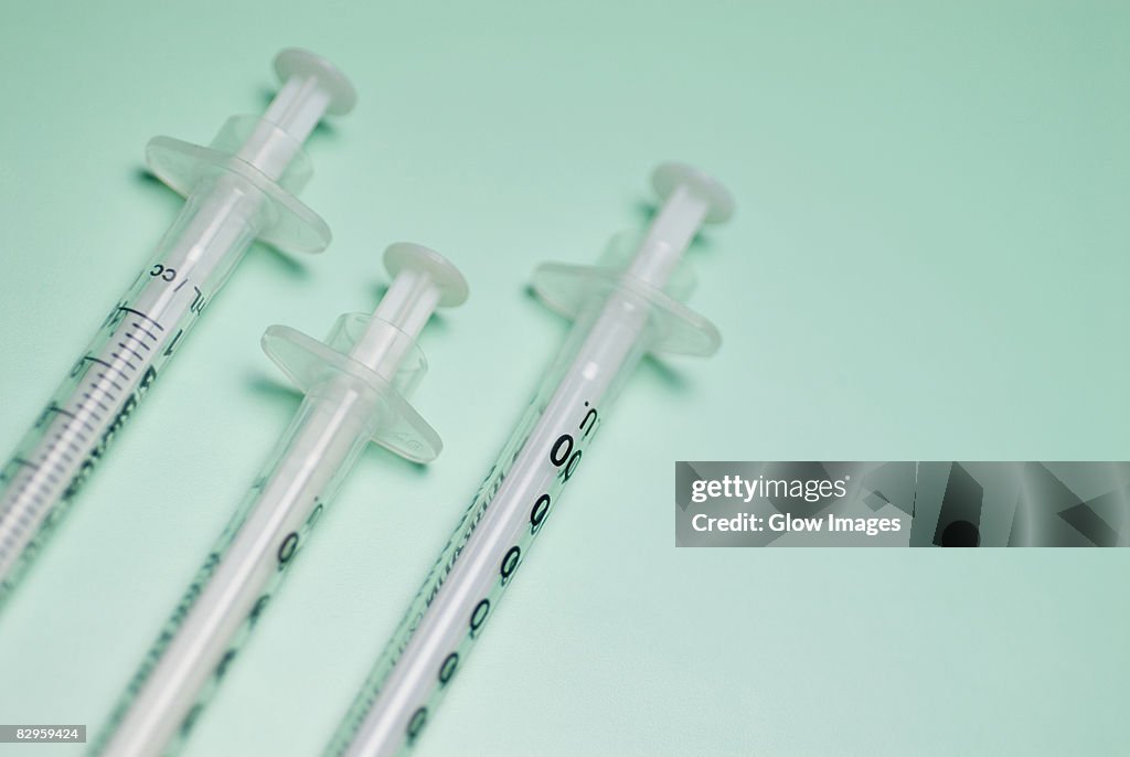 Close-up of three syringes