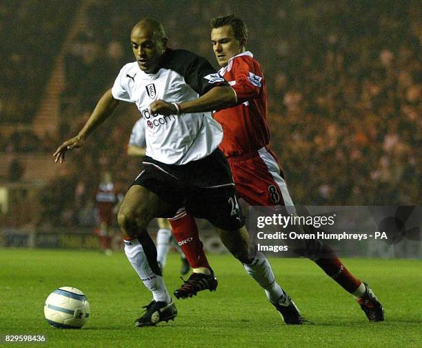 Middlesbrough's Szilard Nemeth battles with Fulham's Alain Goma.