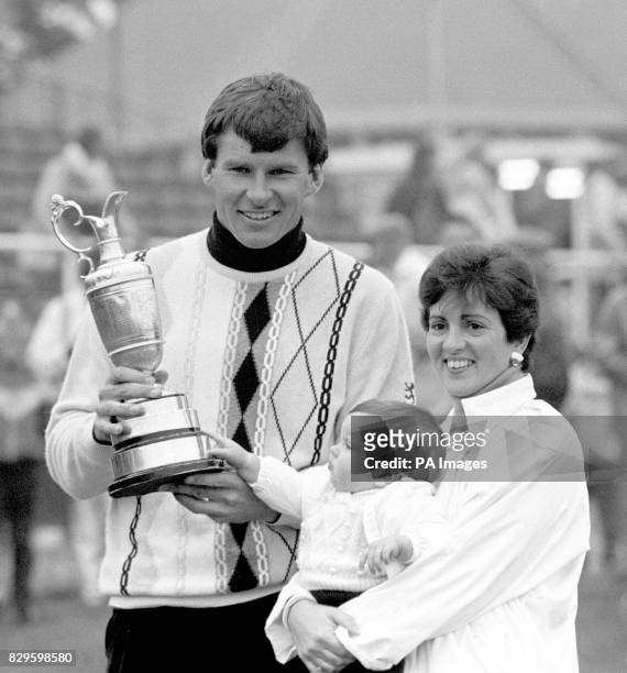 Nick Faldo with his wife Gill and baby Natalie celebrate with the trophy after his victory.