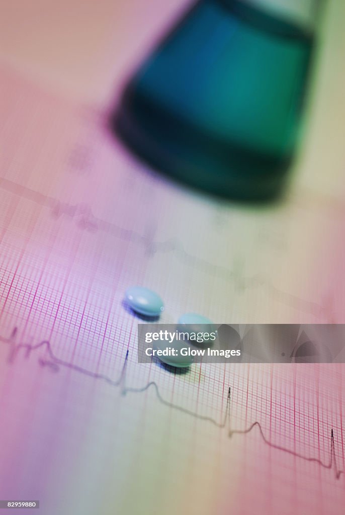 Close-up of pills on a medical record