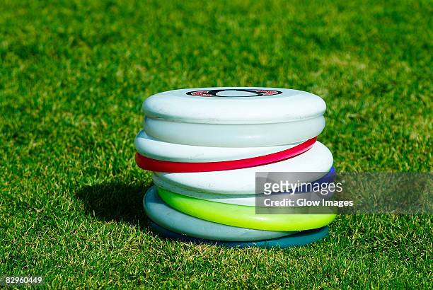 close-up of a stack of plastic discs - frisbee stock pictures, royalty-free photos & images