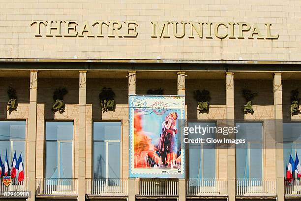 text mounted on the wall of a movie theater, theatre municipal, le mans, sarthe, france - movie poster stock-fotos und bilder