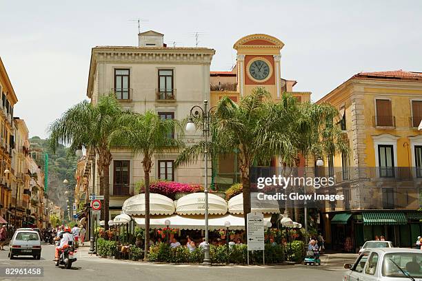 low angle view of a clock tower, piazza tasso, sorrento, naples province, campania, italy - sorrento italy stockfoto's en -beelden