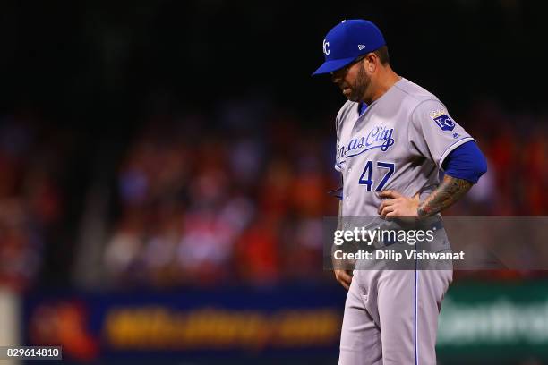 Peter Moylan of the Kansas City Royals reacts after his throwing error against the St. Louis Cardinals allowed a run to score in the sixth inning at...