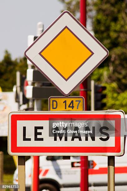 information board on roadside, le mans, france - le mans france stock pictures, royalty-free photos & images