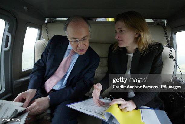 Leader of the Conservatives Michael Howard and his polictical Secretary Rachel Whetstone talk during a flight to Norwich