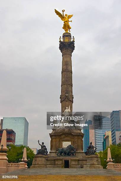 low angle view of a monument, independence monument, mexico city, mexico - angel of independence stock pictures, royalty-free photos & images