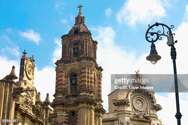 low angle view of a church, iglesia de la profesa, mexico city, mexico - mexico city clock tower stock pictures, royalty-free photos & images